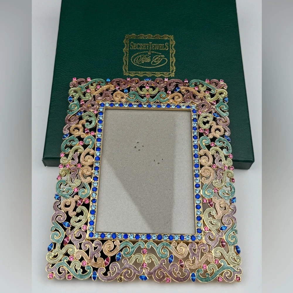 Secret Jewels by Rita G ornate frame.  New in  box. Measures 5” (W) X 6” (L).